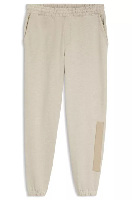 Relaxed-fit tracksuit bottoms in cotton with logo trim