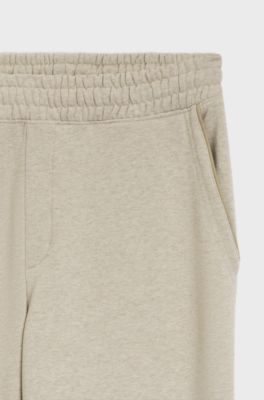 Relaxed-fit tracksuit bottoms in cotton with logo trim, Light Beige