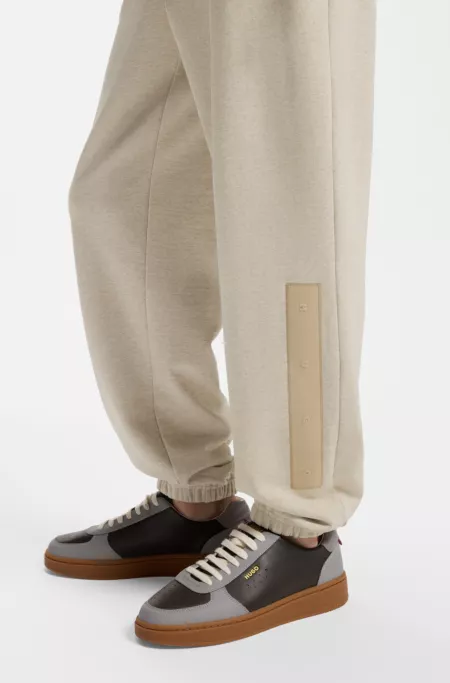 Relaxed-fit tracksuit bottoms in cotton with logo trim