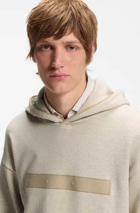Relaxed-fit cotton-terry hoodie with wide-set logo