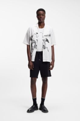 Loafer aus Leder mit perforierten Logos, Schwarz