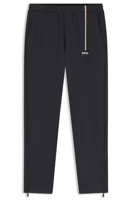 Active tracksuit bottoms in thermoregulating stretch gabardine