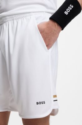 Active Stretch-fabric shorts with mesh pocket bags, White