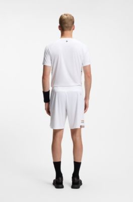 Active Stretch-fabric shorts with mesh pocket bags, White