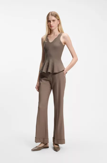 Peplum top with eye-catching neckline detail