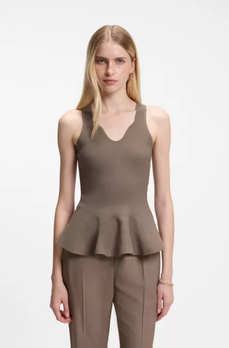 Peplum top with eye-catching neckline detail