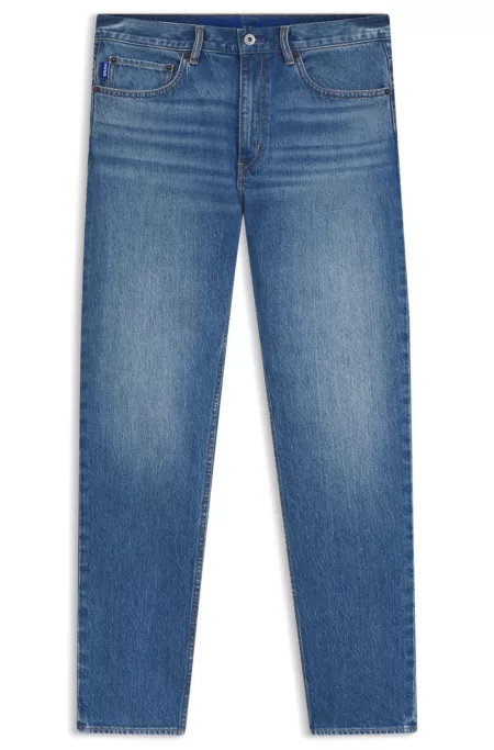 Jeans slim fit de denim elástico en azul medio