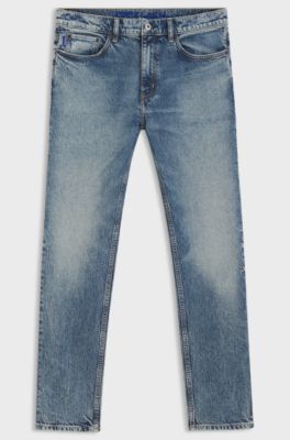 Jeans slim fit in denim elasticizzato blu effetto stone-washed, Blu