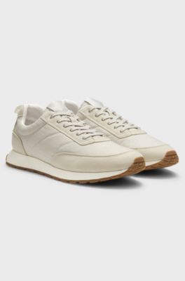 Sneakers met hardloopinspiratie, met een bovenzijde van monogramjacquard, Lichtbeige