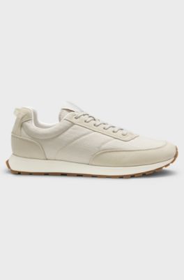 Sneakers met hardloopinspiratie, met een bovenzijde van monogramjacquard, Lichtbeige