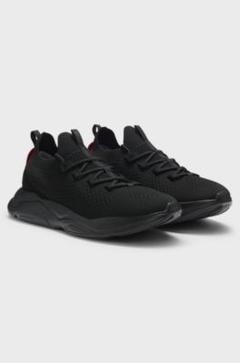Sneakers in maglia con suola in EVA goffrata con logo, Nero