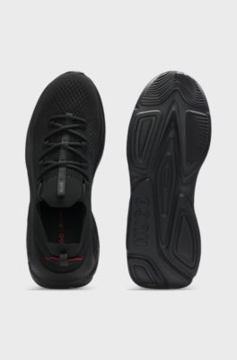 Sneakers in maglia con suola in EVA goffrata con logo, Nero