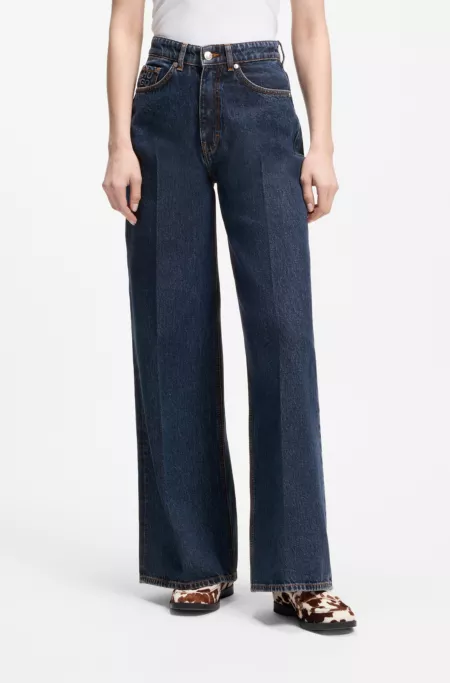 Jeans aus blauem Denim mit weitem Beinverlauf und Bundfalten auf der Vorderseite