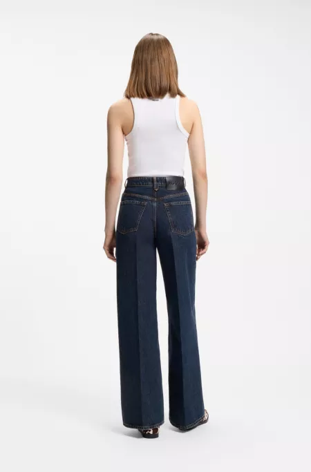 Jeans aus blauem Denim mit weitem Beinverlauf und Bundfalten auf der Vorderseite