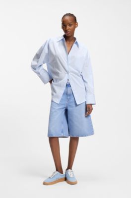 Baskets en cuir su&eacute;d&eacute; avec logos superpos&eacute;s, bleu clair