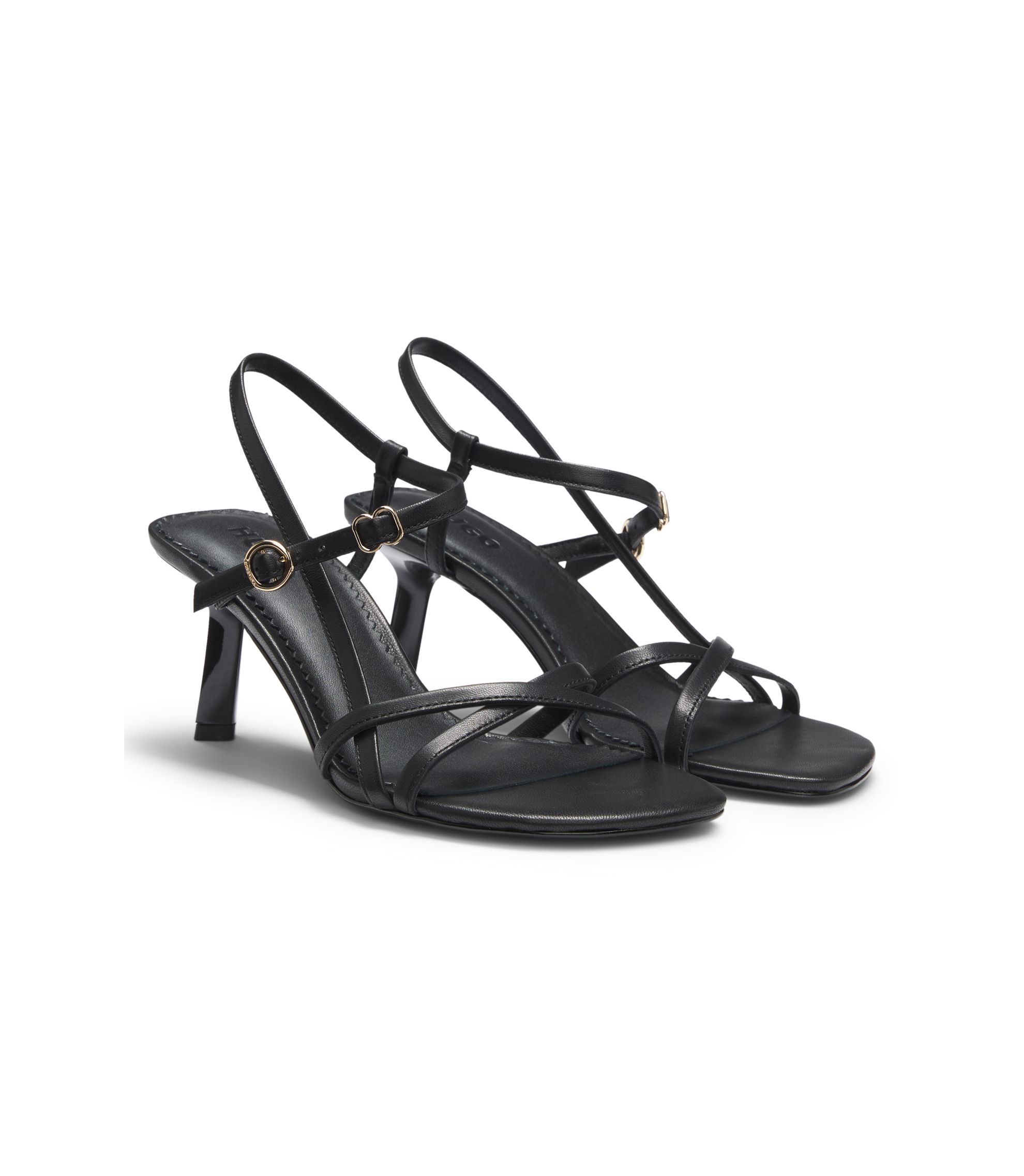 Ledersandalen mit asymmetrischem Absatz und Riemen