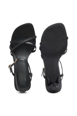 Strappy sandals in leather with asymmetric heel, Black