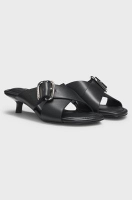 Mules in pelle con cinturini incrociati con fibbia, Nero
