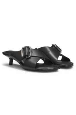 Leather mules with crossed buckled straps 1
