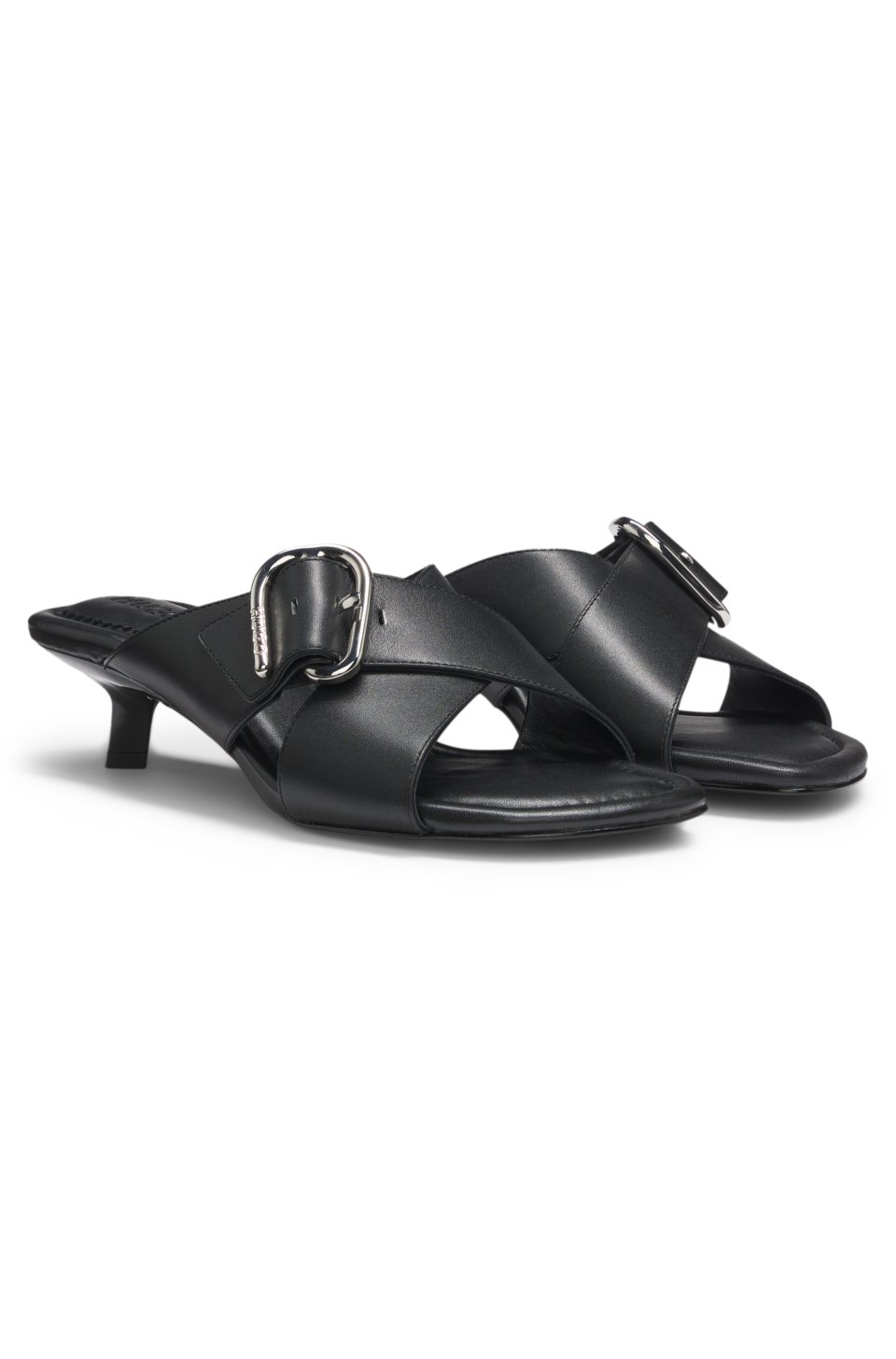 Leather mules with crossed buckled straps