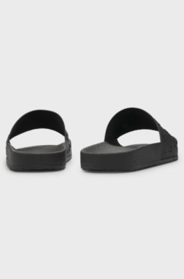 Slides with repeat stacked-logo uppers, Black