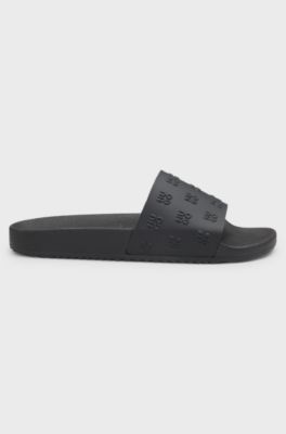 Sandali slider con tomaia con logo ripetuto scomposto, Nero