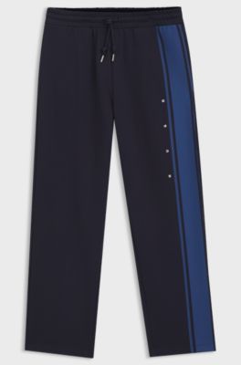 Relaxed-fit tracksuit bottoms in cotton with side stripe, Dark Blue