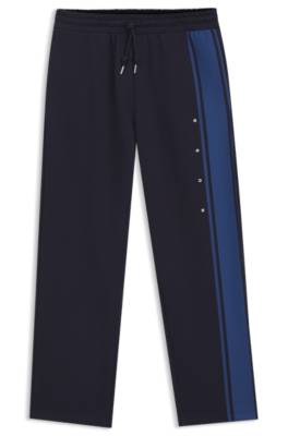 Relaxed-fit tracksuit bottoms in cotton with side stripe 1