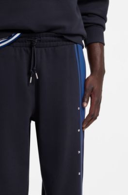Relaxed-fit tracksuit bottoms in cotton with side stripe, Dark Blue