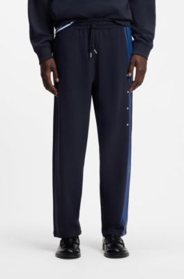 Relaxed-fit tracksuit bottoms in cotton with side stripe, Dark Blue
