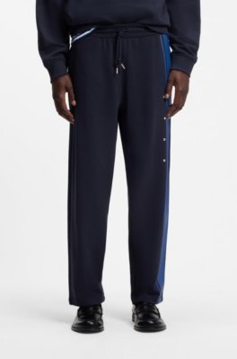 Relaxed-fit tracksuit bottoms in cotton with side stripe