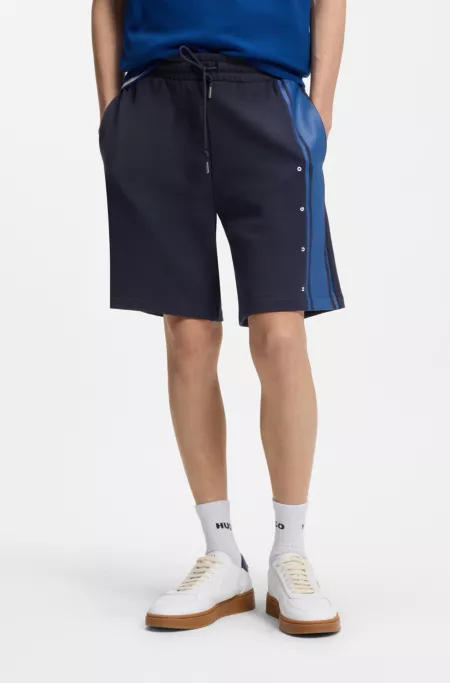 Relaxed-fit shorts in cotton terry with side stripe