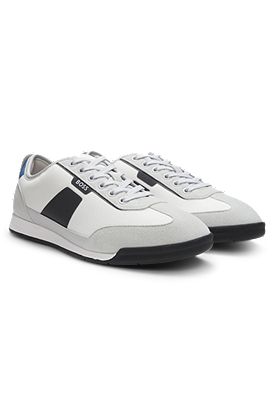Mixed-material trainers with ridged outsole