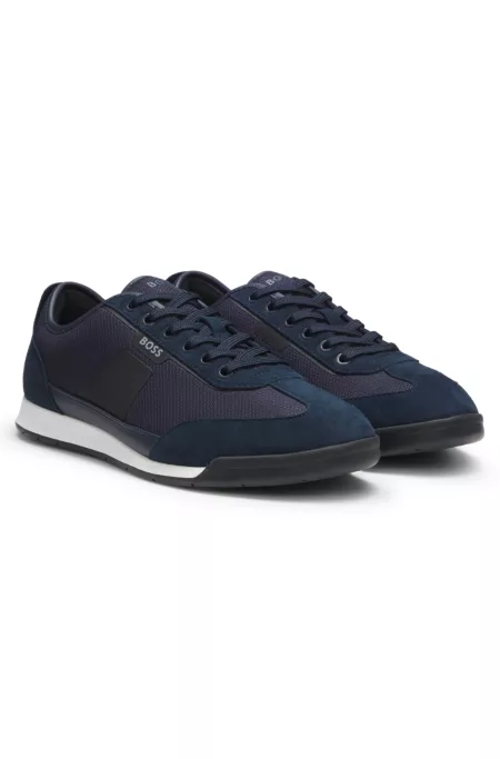 Mixed-material trainers with ridged outsole