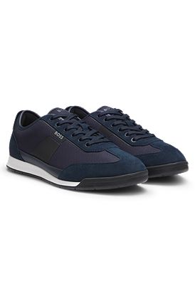 Mixed-material trainers with ridged outsole