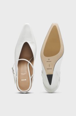 Glossy leather mules with wedge heel and strap, White