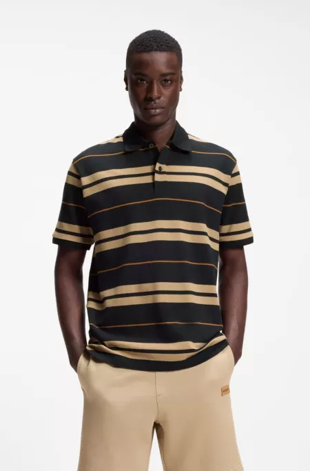 Regular-fit polo in cotton piqué with engineered stripes