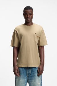 Loose-fit T-shirt in cotton with suede logo badge, Beige
