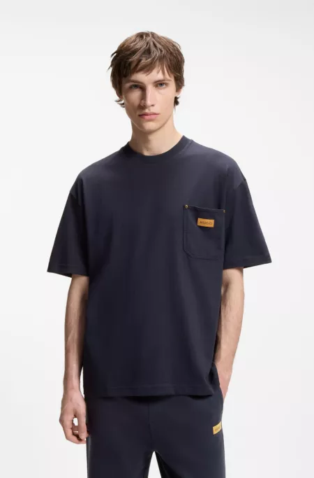 Loose-fit T-shirt in cotton with suede logo badge
