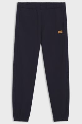 Cotton-terry tracksuit bottoms with logo badge, Dark Blue