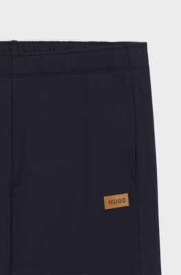 Cotton-terry tracksuit bottoms with logo badge, Dark Blue