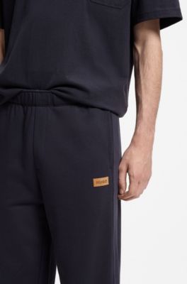 Cotton-terry tracksuit bottoms with logo badge, Dark Blue