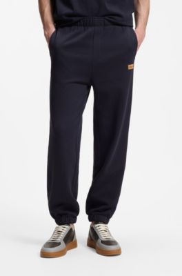 Cotton-terry tracksuit bottoms with logo badge, Dark Blue