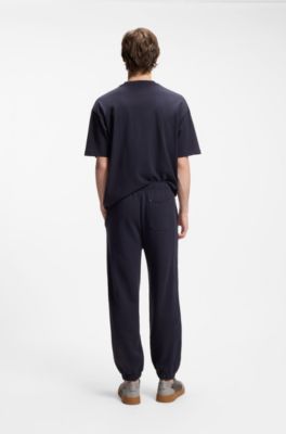 Cotton-terry tracksuit bottoms with logo badge, Dark Blue