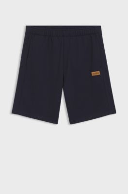 Regular-fit shorts in cotton with suede logo badge, Dark Blue