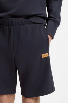 Regular-fit shorts in cotton with suede logo badge, Dark Blue