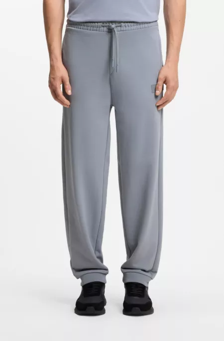 Pantalones relaxed fit en innovadora felpa de rizo