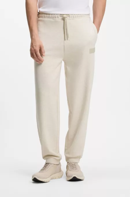 Pantalones relaxed fit en innovadora felpa de rizo