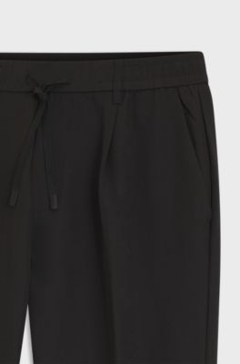 Active tapered-fit trousers in water-repellent stretch fabric, Black