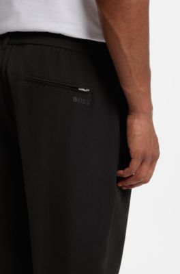 Active tapered-fit trousers in water-repellent stretch fabric, Black